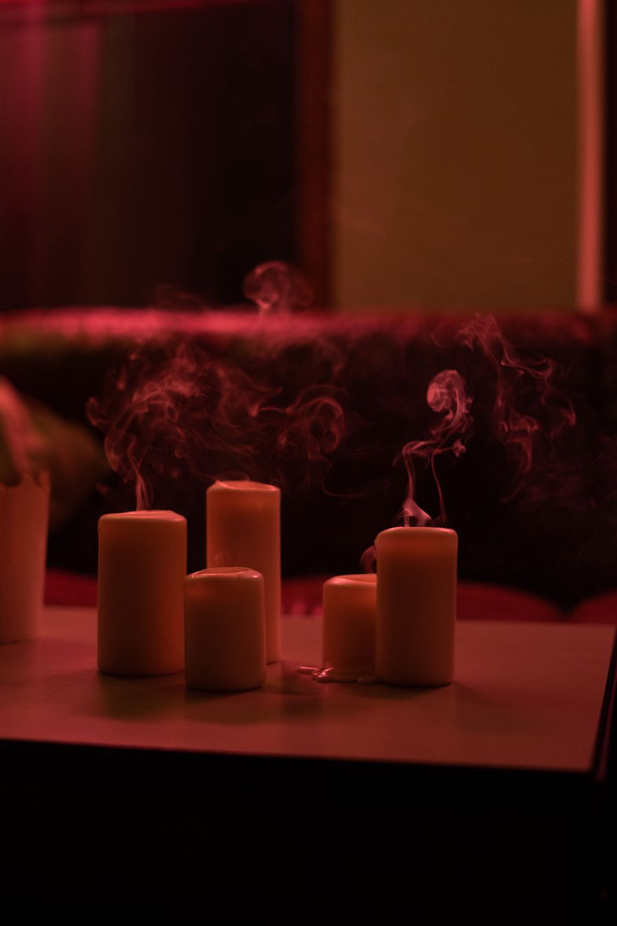 A warm, candlelit home interior in the evening